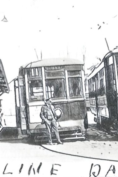 A conductor stands in front of two trolley cars idling at the transit loop in Darby Borough, sometime in the 1920s.